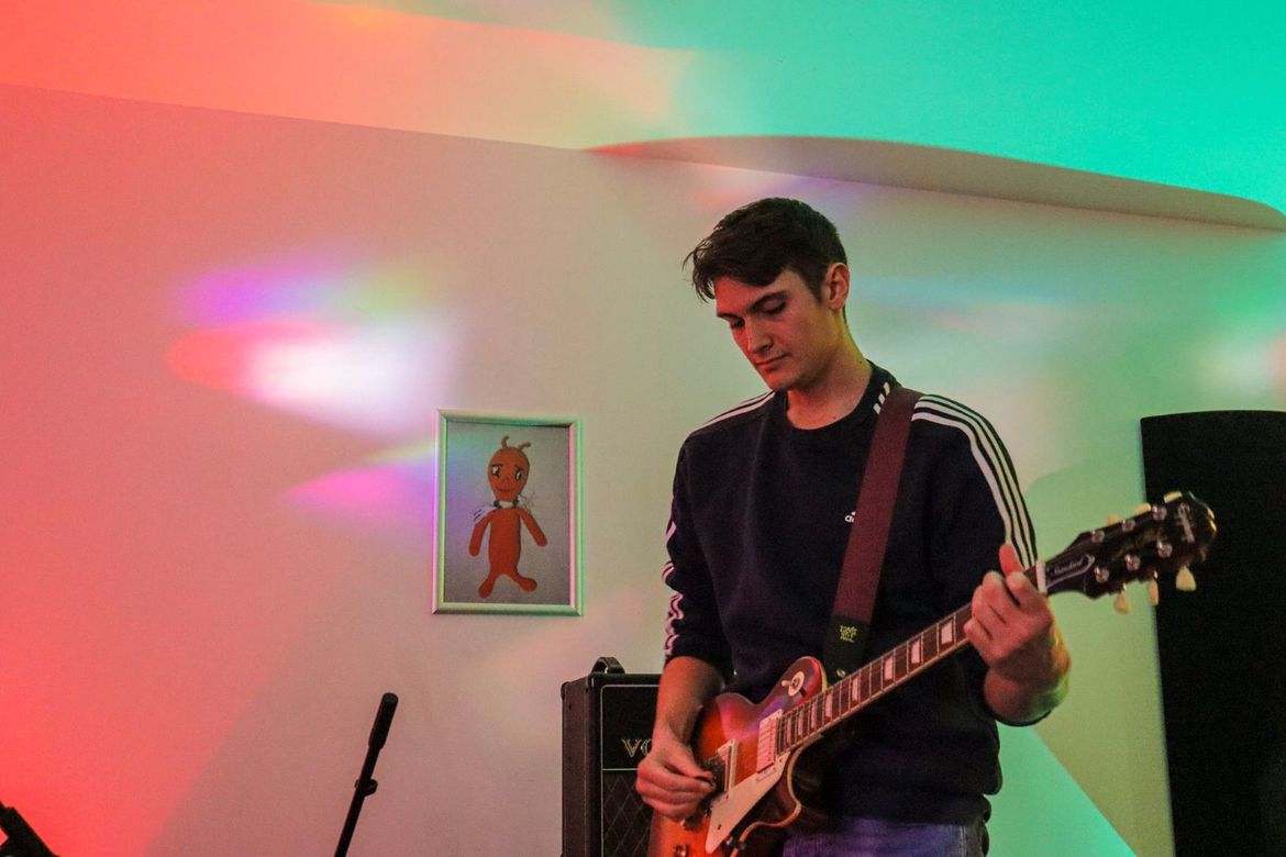 Dan Simpkins playing electric guitar in studio