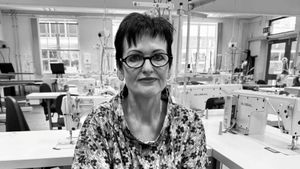 Black and white photo of Gunta Andrews in ARU's fashion workshop