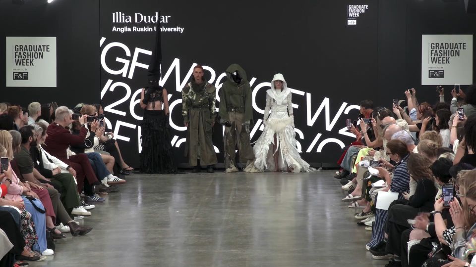 Four models lined up in front of screen on GFW2026 catwalk wearing various middle-eastern themed outfits