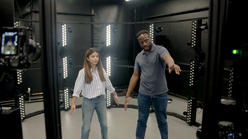 A male and female student inside the full-body scanner at ARU Cambridge