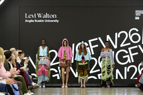 Four models posing for group photo wearing different colourful outfits on GFW 2025 catwalk