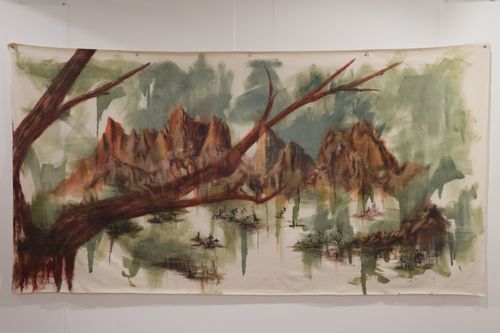 Painting of rocky mountains seen through tree branch