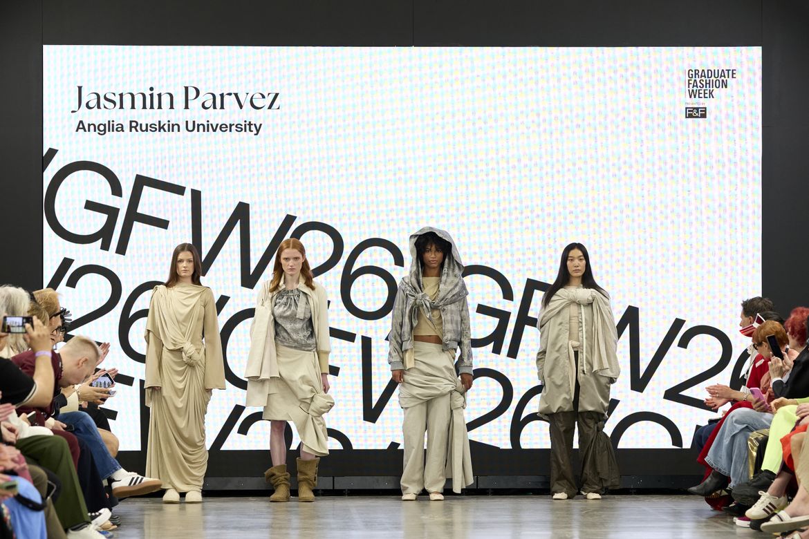 Four models posing for group photo wearing different beige outfits on GFW 2025 catwalk