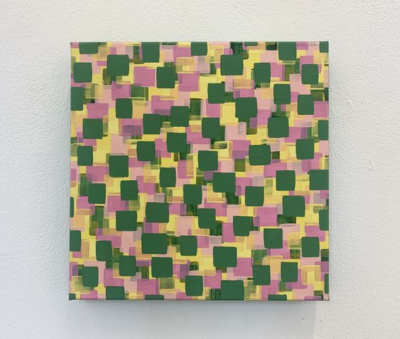 An up close image of a painting of colourful squares