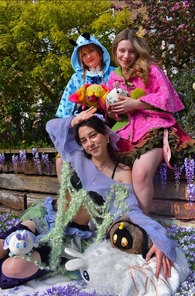 Photo of three female models wearing different colourful outfits with plushie animals