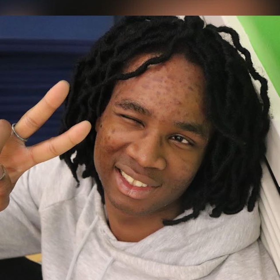 Benedict Odobeatu making a victory sign with his fingers