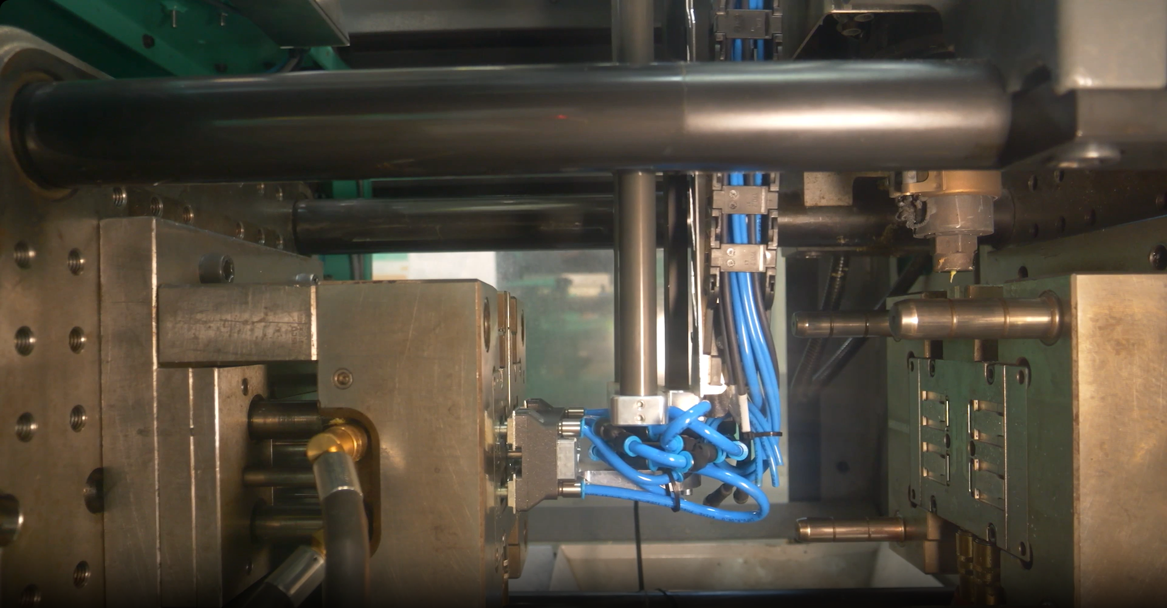 Automated insertion into injection molding machine