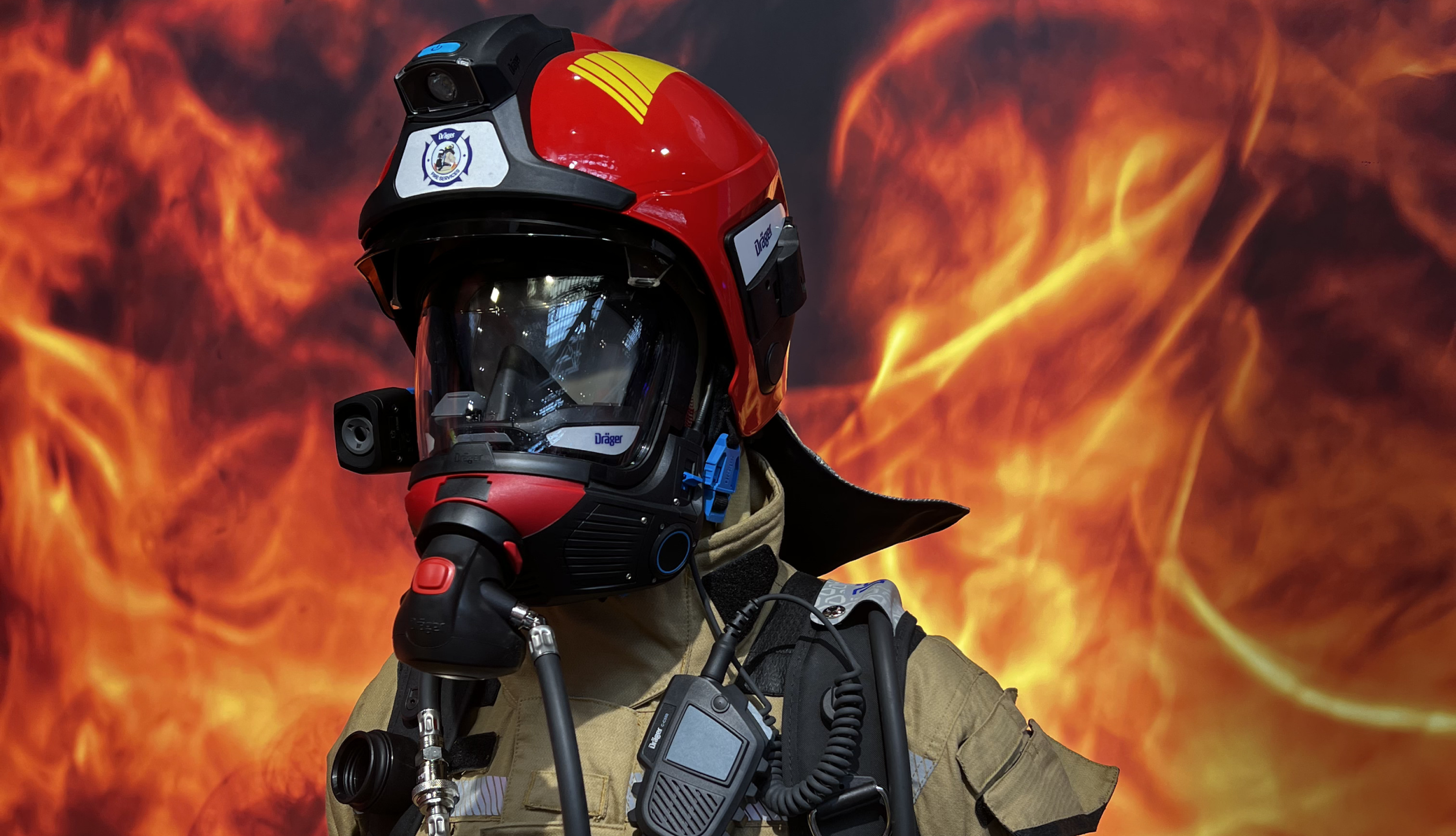 Firefighter gear standing against a fiery background, fully equipped with safety gear and communications equipment.