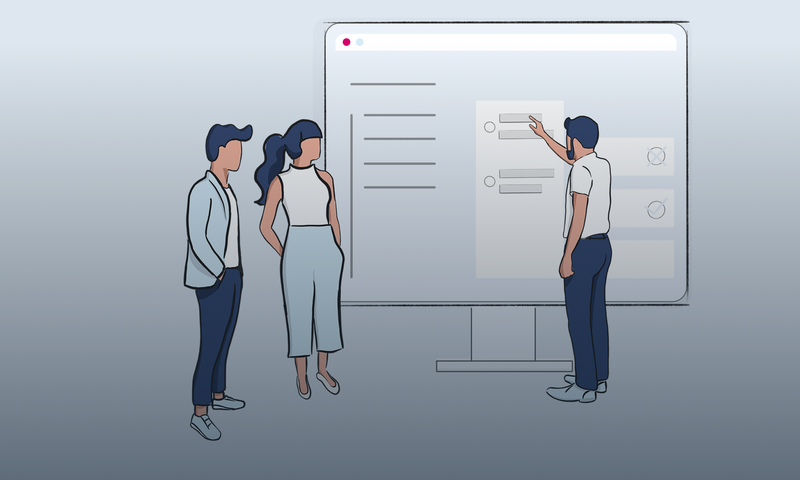Three people stand in front of a large screen, with one person pointing at it, appearing to discuss or present information.