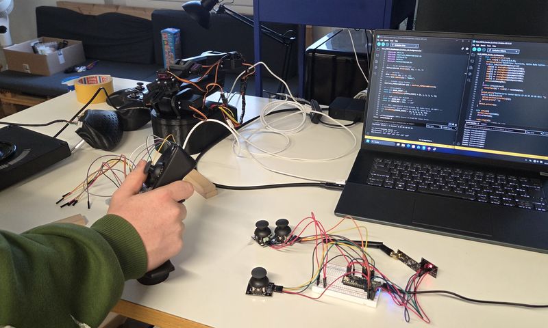 A laptop on which the programming code can be seen.