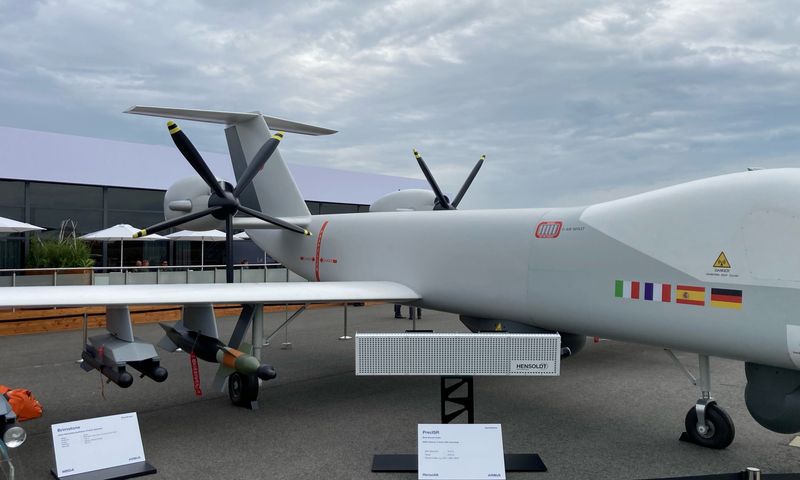 A full-scale model of an aeroplane at a trade fair.