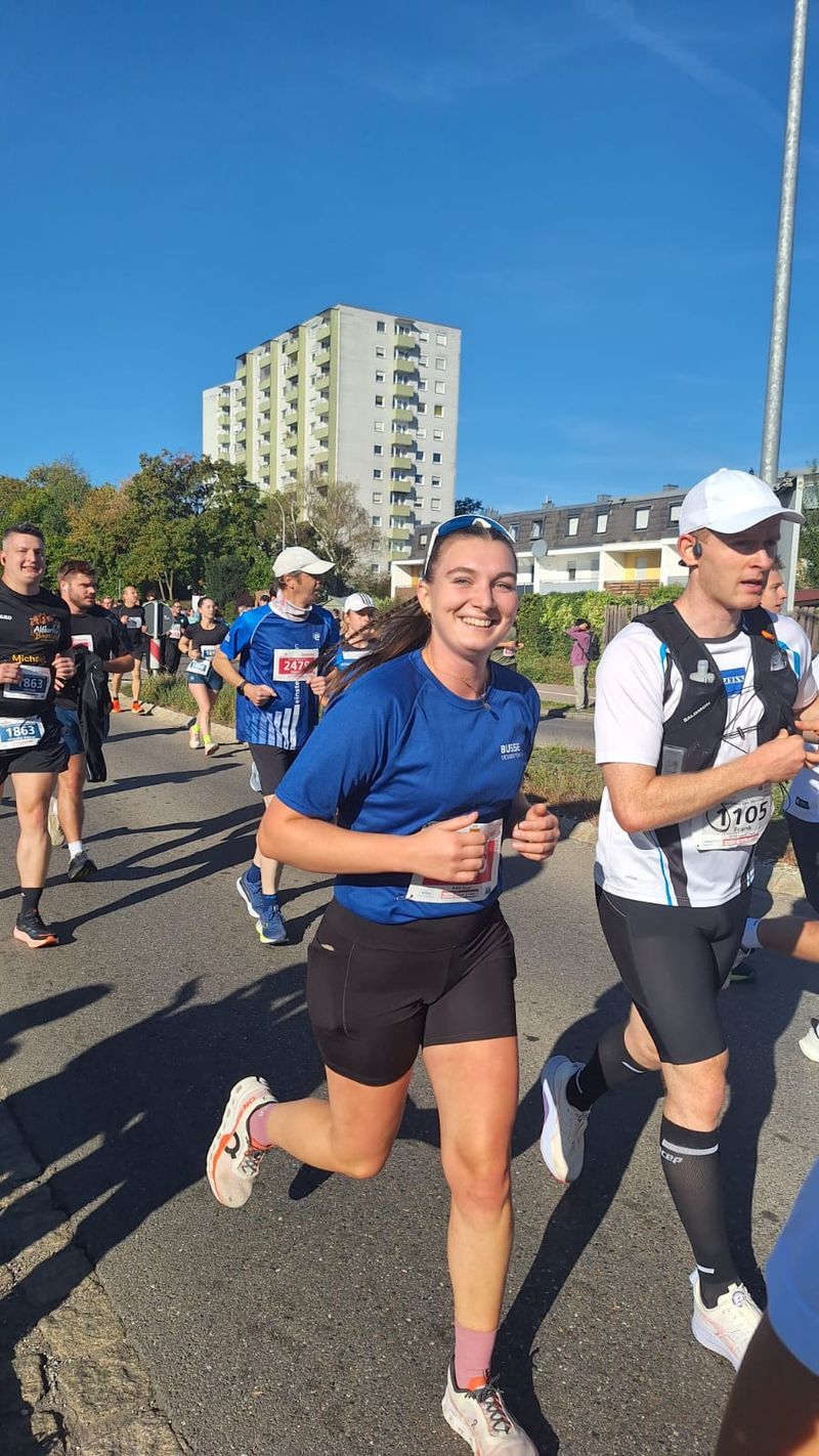 A Busse employee is jogging happily.