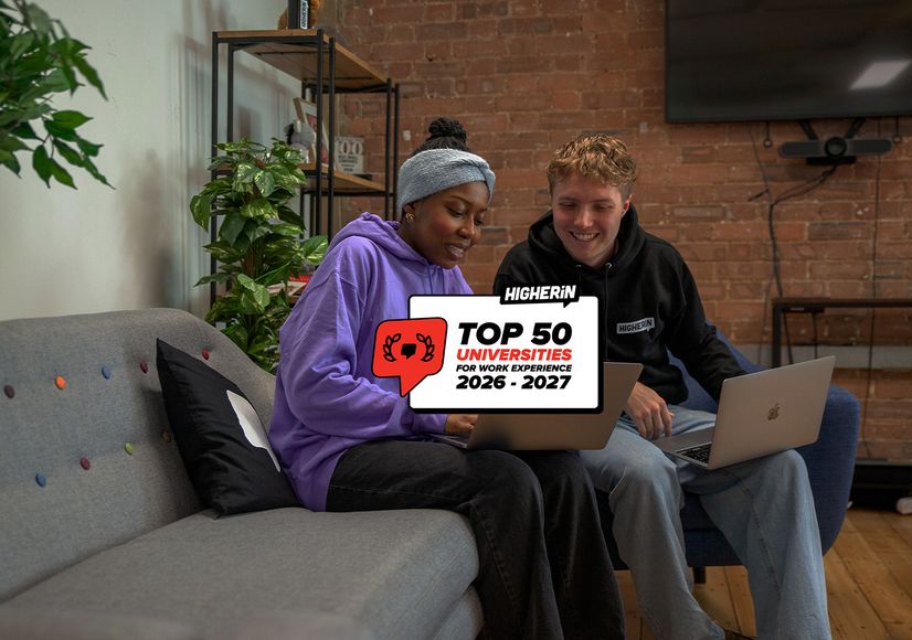 Two students sit on a sofa using laptops, with a logo for "Top 50 Universities for Work Experience 2026-2027" overlaid.