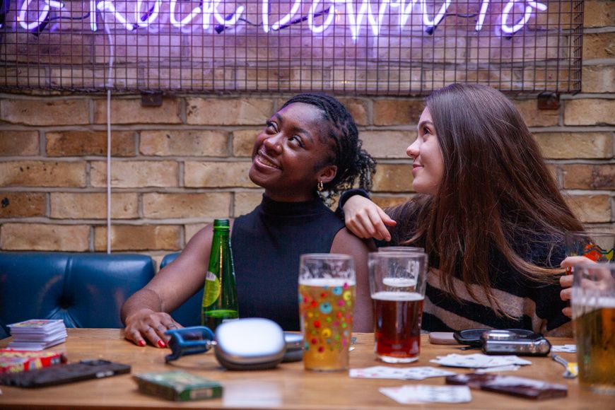 two girls having their photo taken together