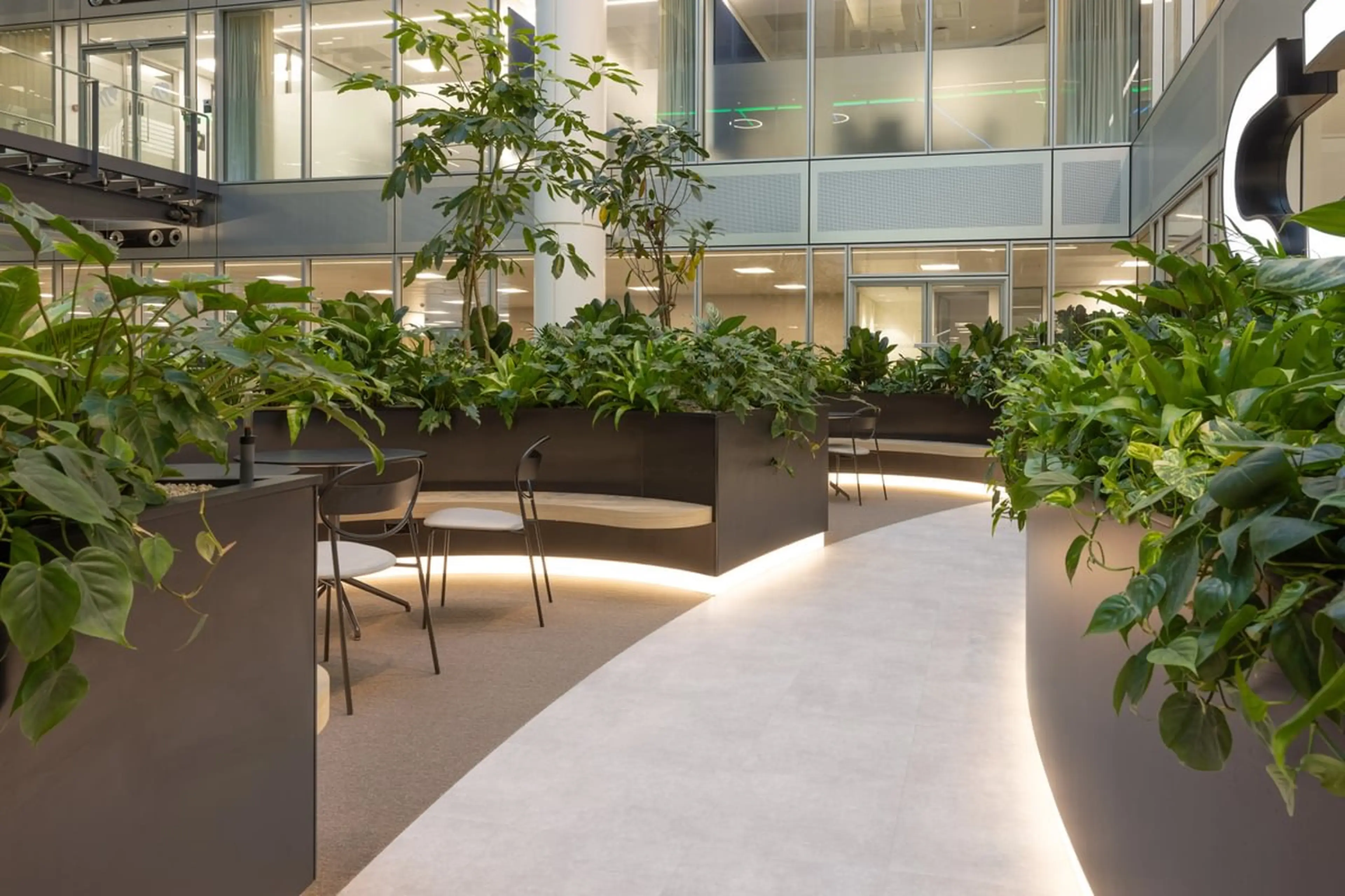 Open indoor balcony with lush planting