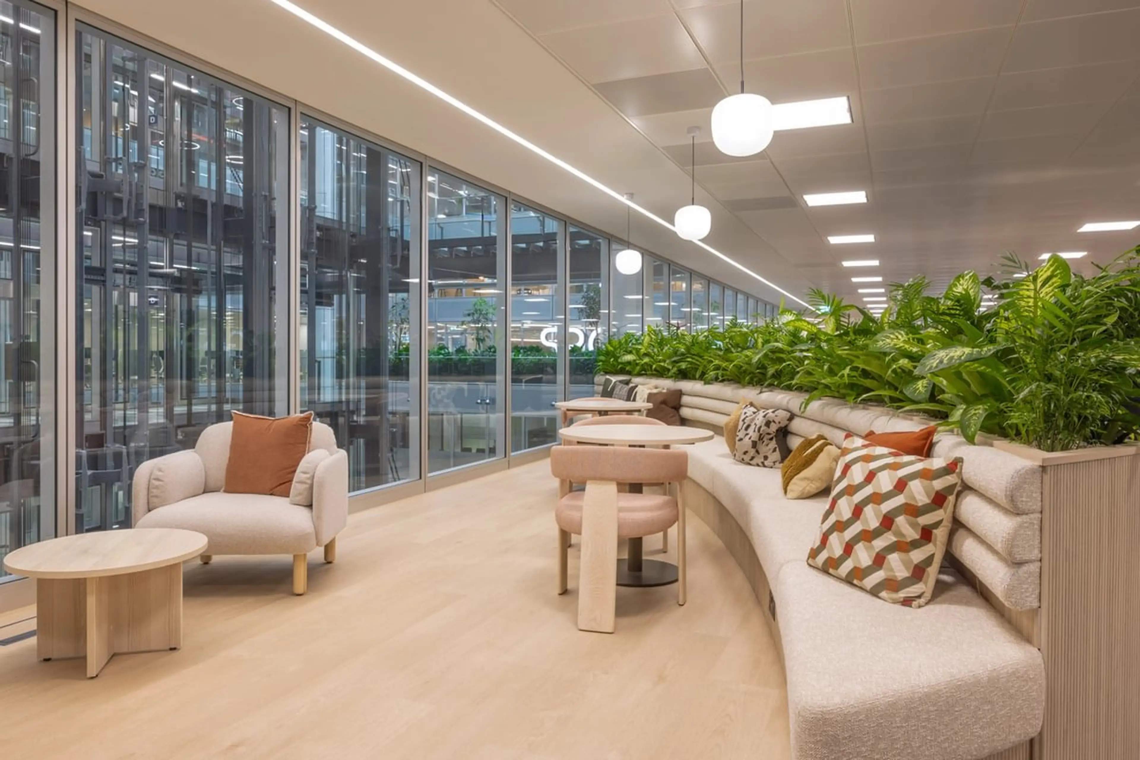 Office seating with lush green plants behind