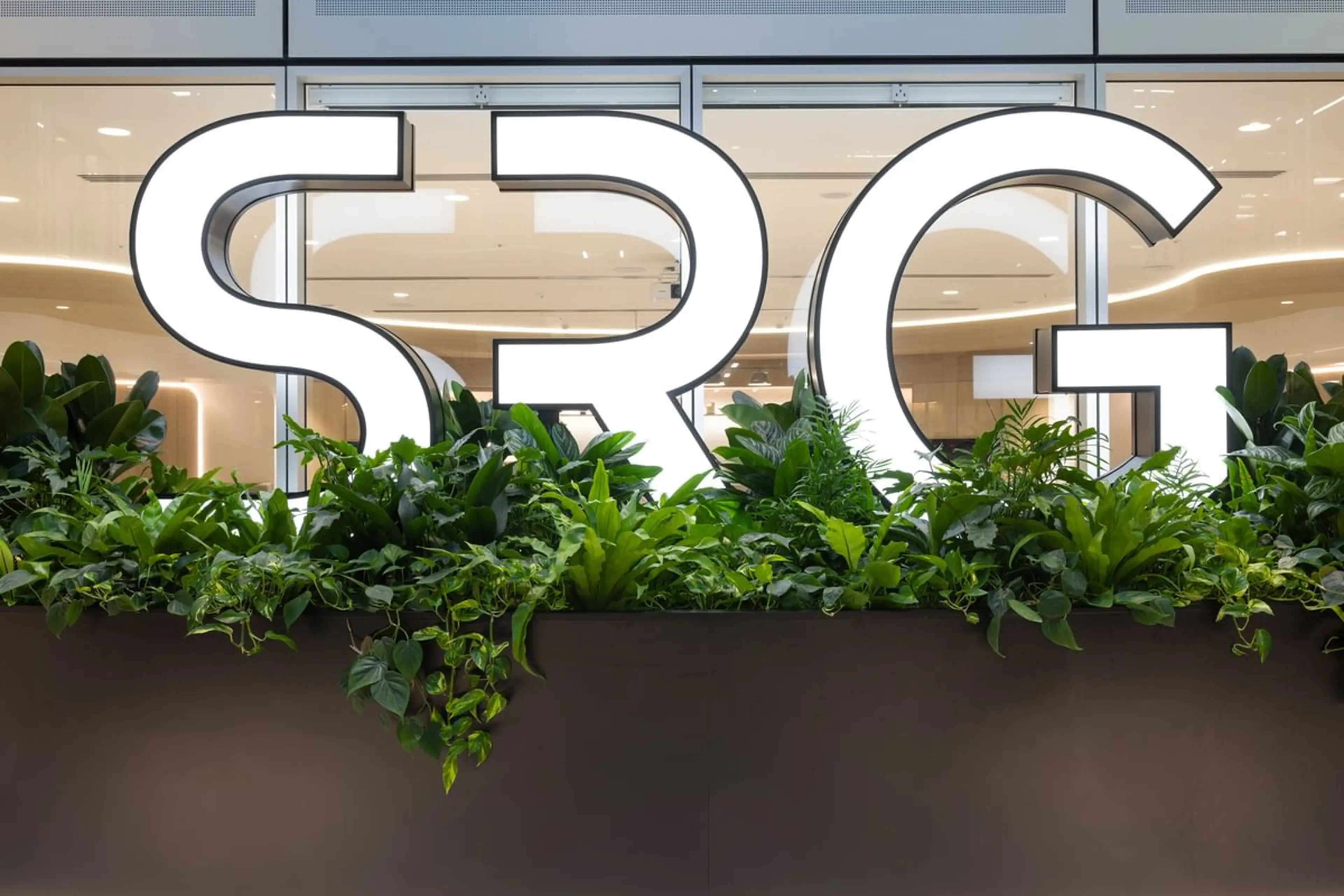 SRG logo with plants infront