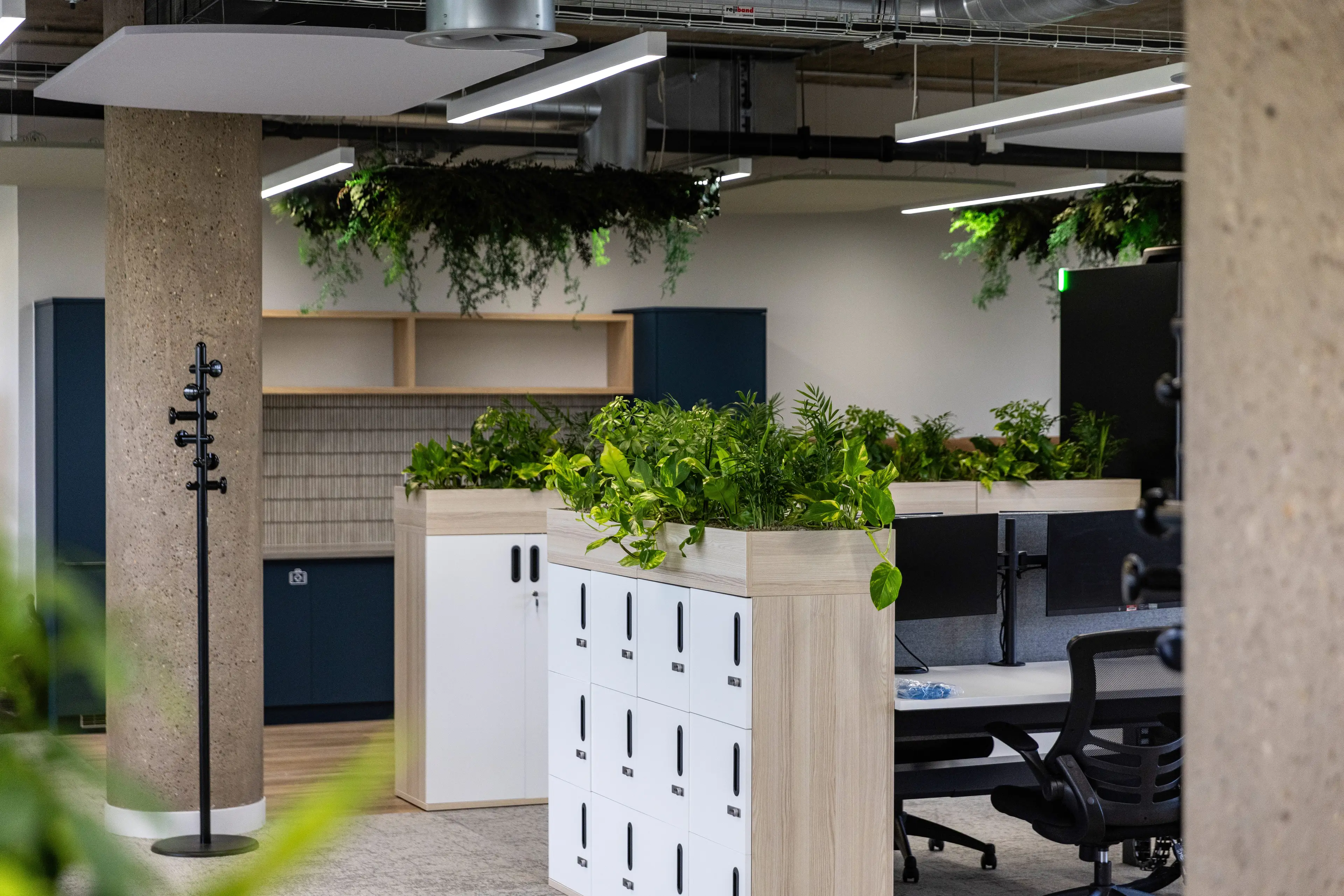 office with end of office trough planting, as well as hanging plants