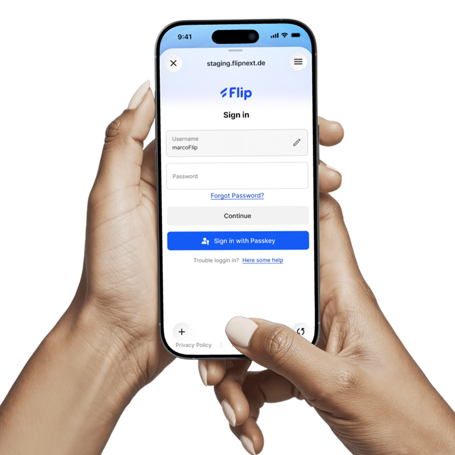 Flip login screen on a smartphone held by hands.