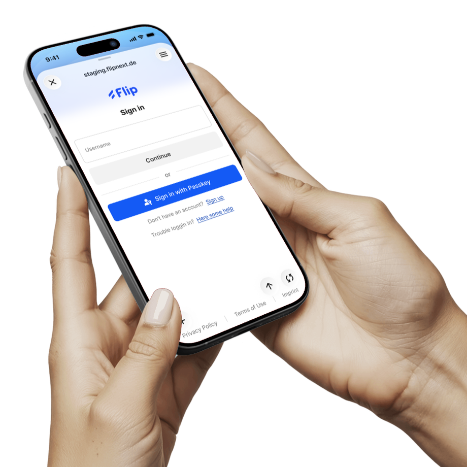 Flip login page on a smartphone held in hands.