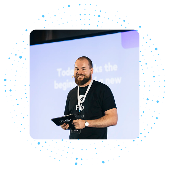 Man speaking on stage with Today marks the beginning of a new on screen.