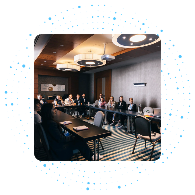 People in a conference room attending a meeting.