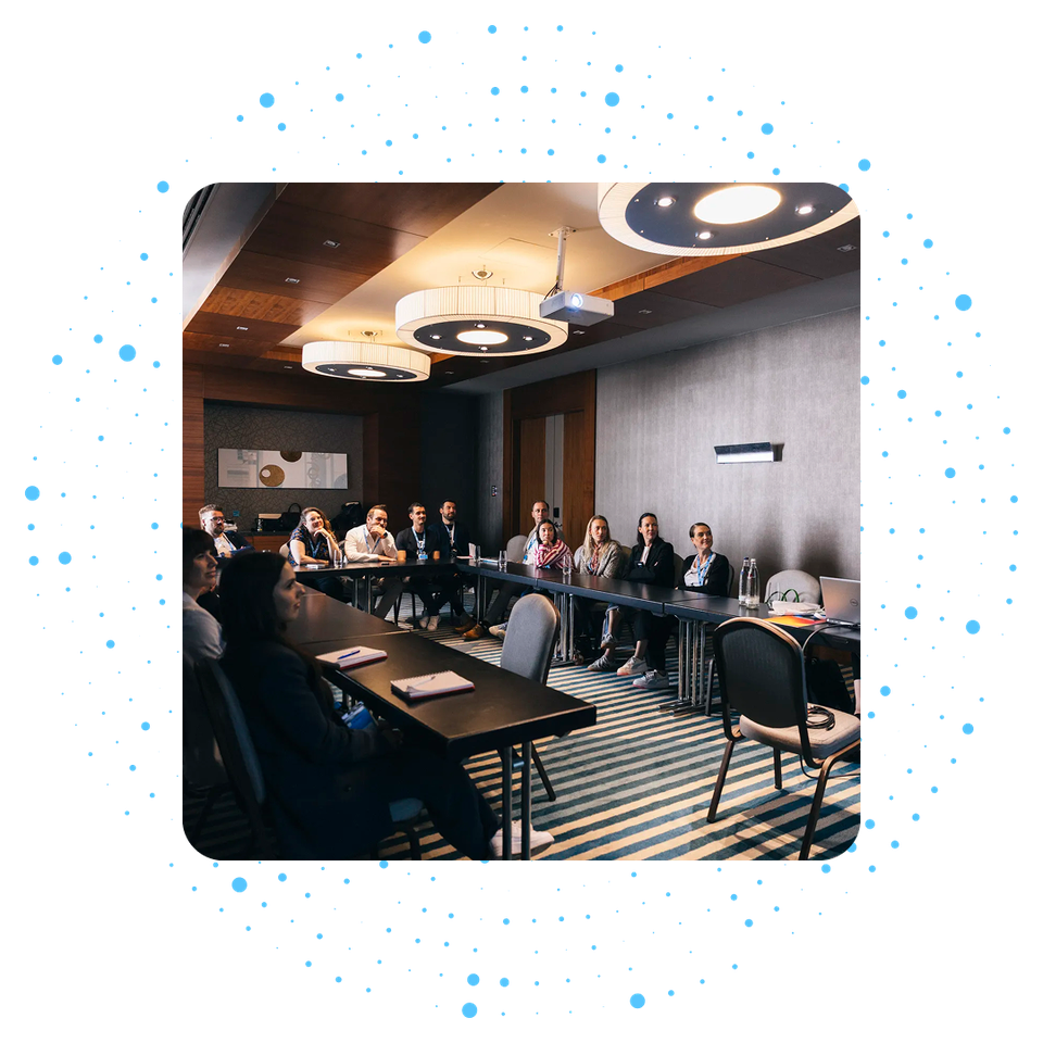 People in a conference room attending a meeting.