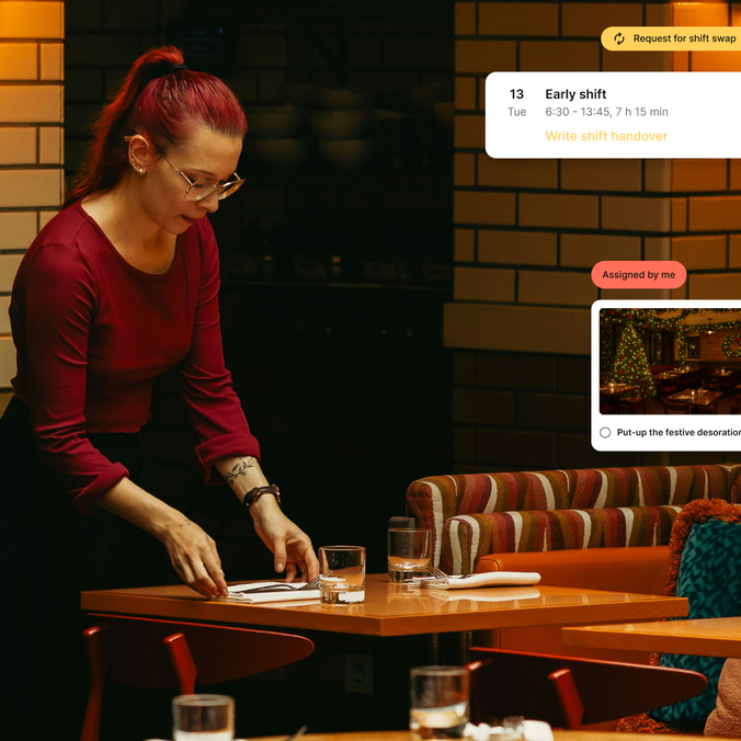 Employee setting a table with shift details overlay.