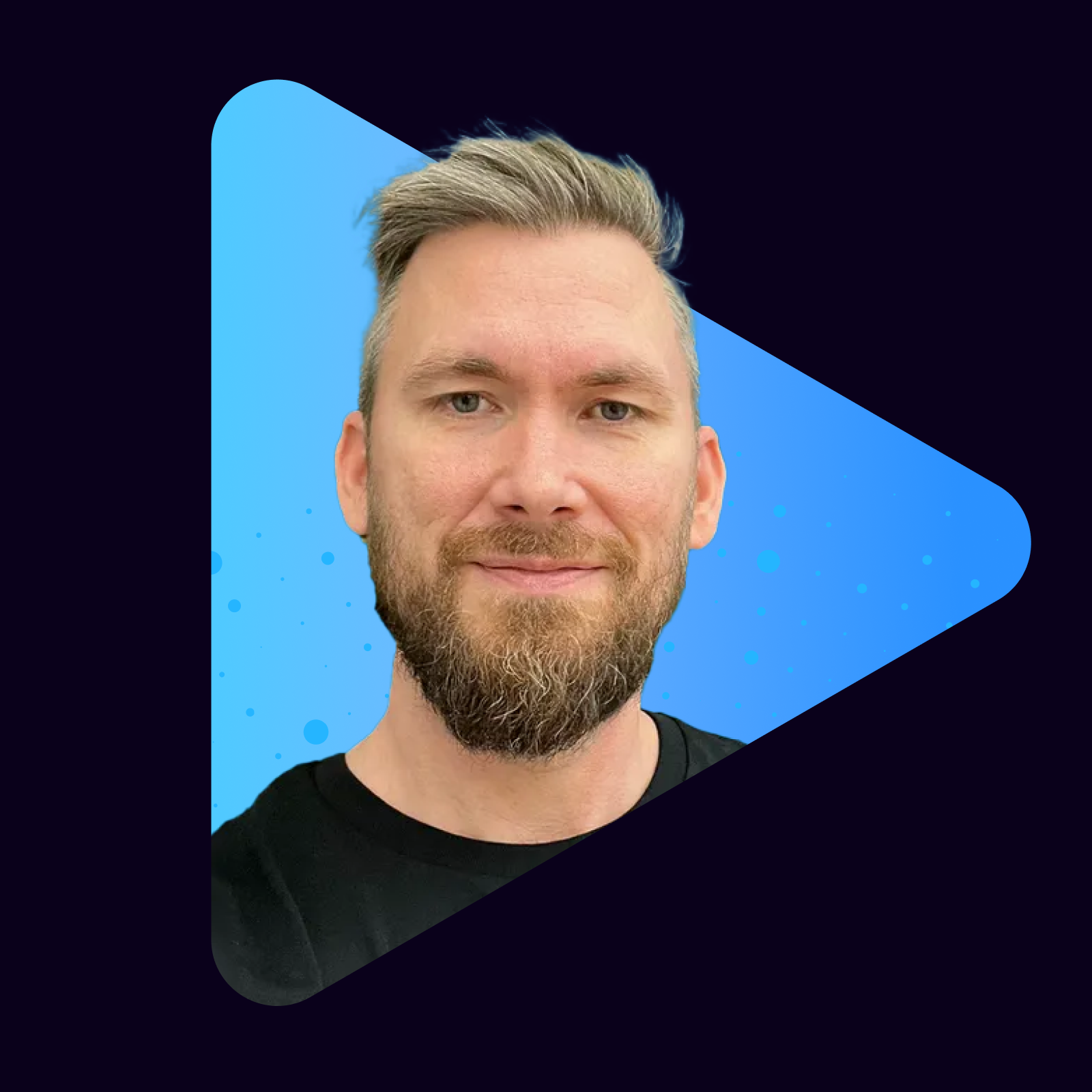 Portrait of a man with a beard on a blue triangular background.