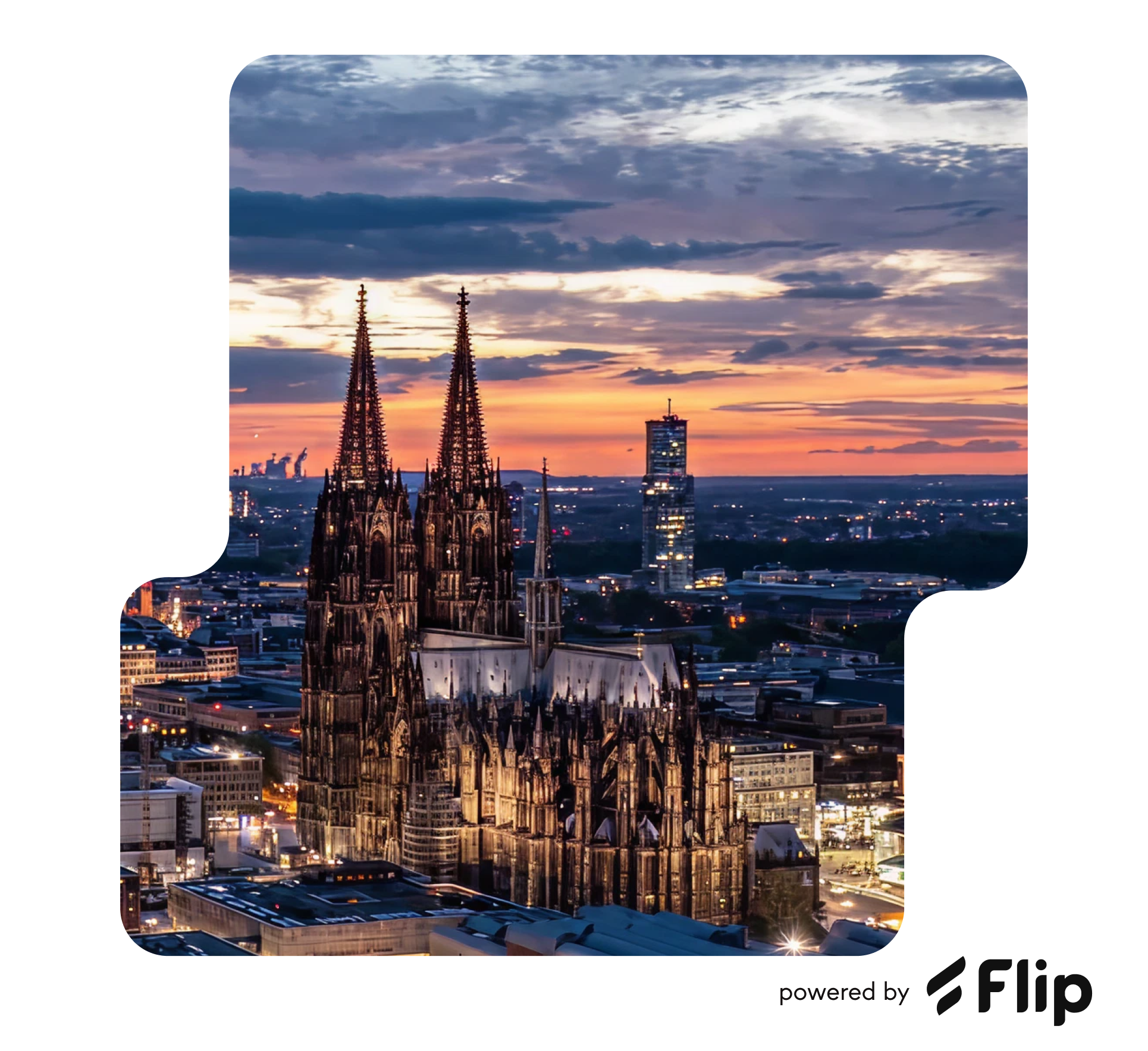 Cologne Cathedral at sunset with city skyline.