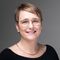 Smiling woman with short hair and glasses