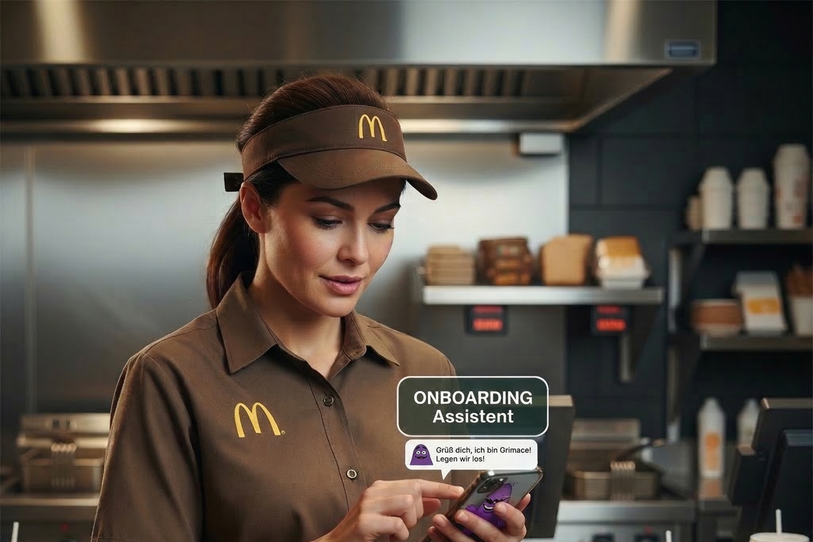 McDonalds employee using an onboarding assistant app on a smartphone.