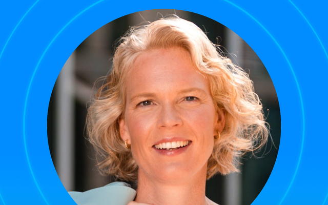 Smiling person with short blonde hair in a blue-themed circular design.