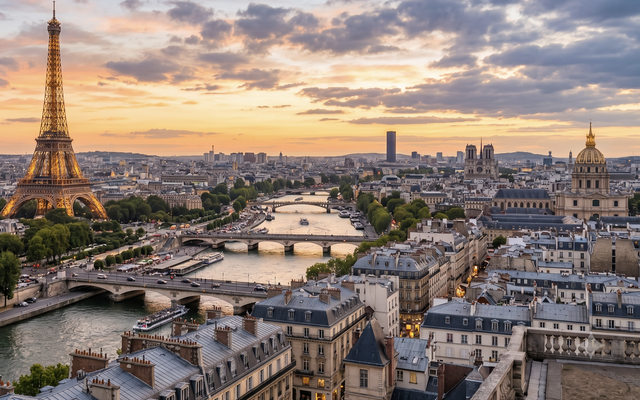 Paris skyline with Eiffel Tower and River Seine at sunset.