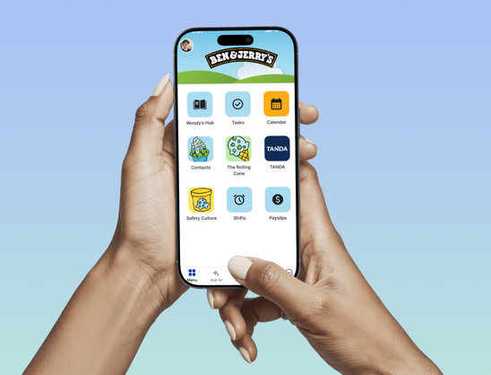 Hands holding phone with Ben & Jerrys app interface.