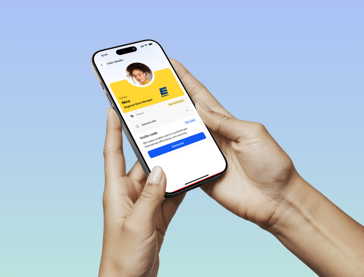 Hands holding phone with app showing user details for Nima, Regional Store Manager.