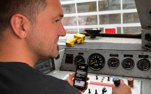 Person operating a train using a mobile app.