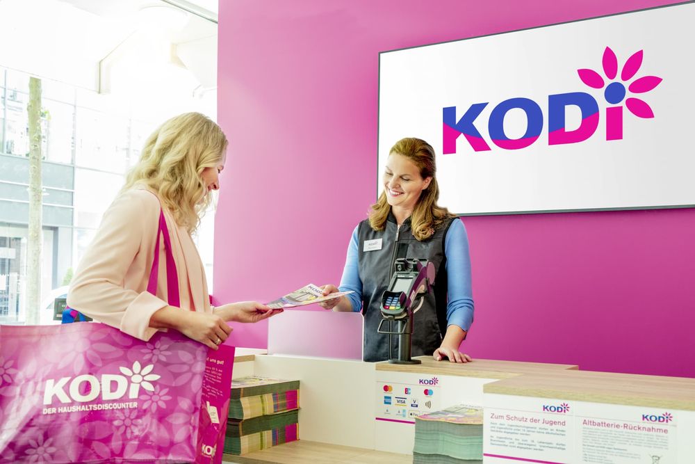 Two women at a KODi store counter.