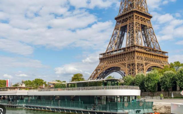 The Eiffel Tower viewed from the Seine River in Paris.