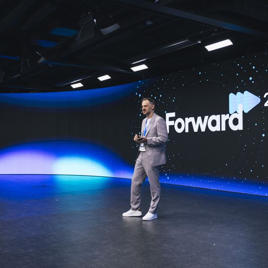 Speaker on stage at Forward 2026 conference.