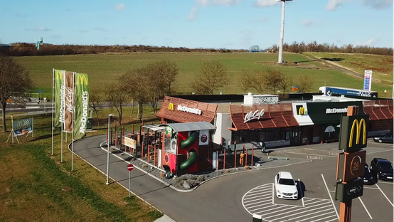 Aerial view of a McDonalds restaurant with signage and flags.
