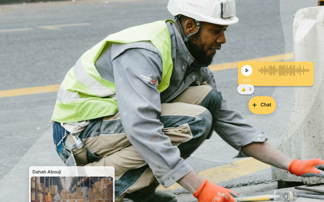 Road worker in high vis and a hard hat kneeling on a construction site, surrounded by chat message bubbles and a voice message window.