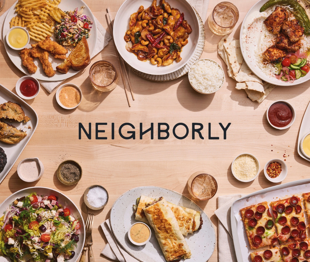 A table with various dishes including pasta, salad, pizza, and drinks, surrounding the word "NEIGHBORLY" on a wooden surface.
