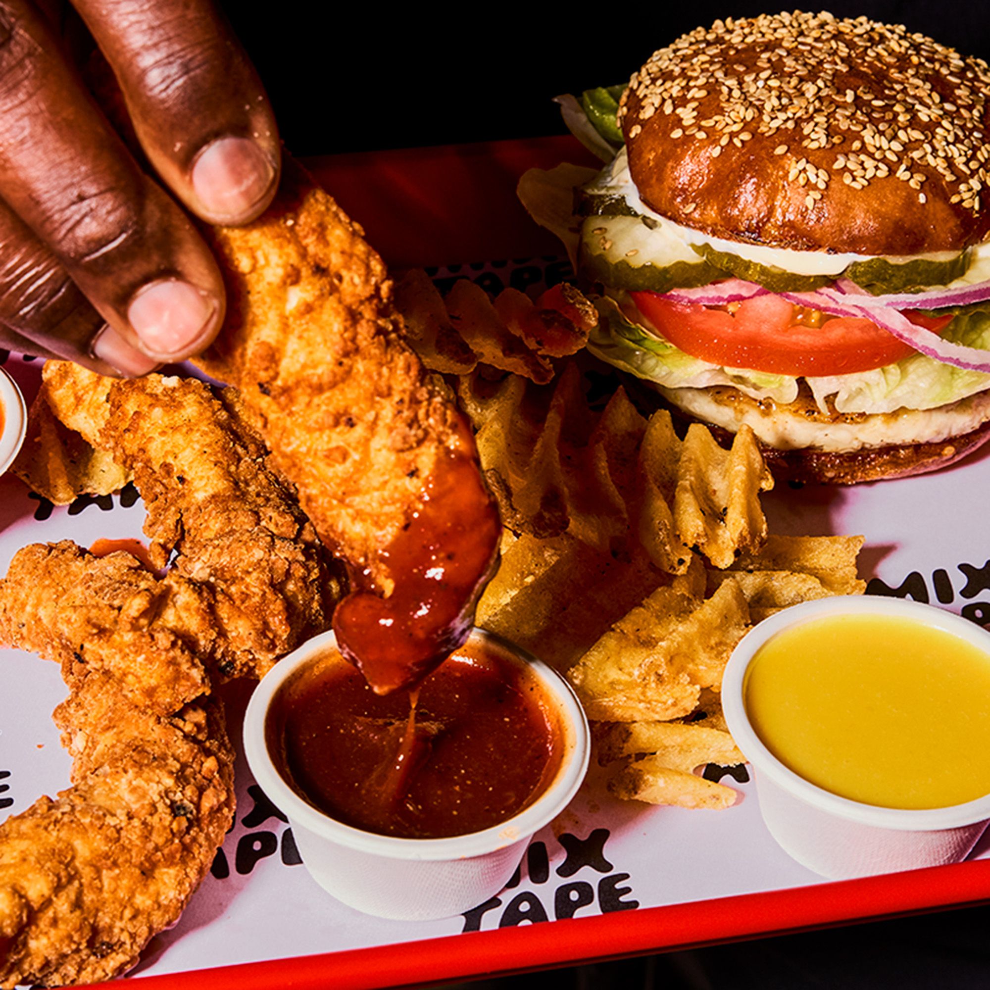 Tenders dipping in sauce