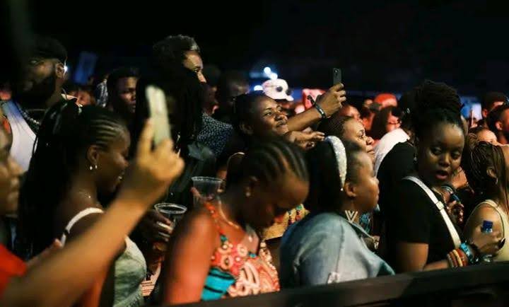 Festival-goers at Sauti za Busara 2024 enjoying the sun, music and friendship.