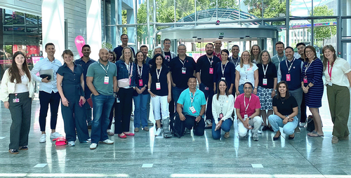 A diverse group of people in a entrance hall
