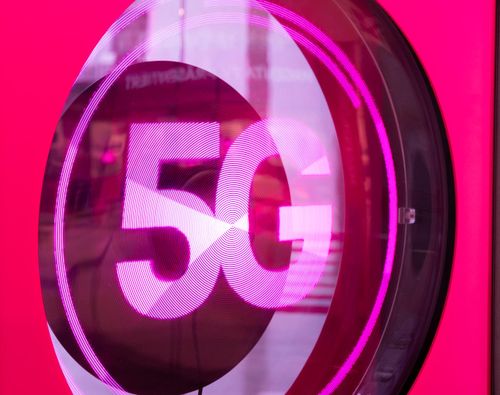 A 3D pink and white 5G logo on a vibrant pink background, symbolizing high-speed wireless technology.