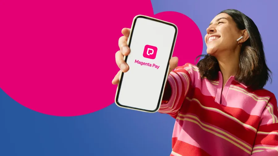 Smiling person in a striped pink sweater holds a smartphone displaying the "Magenta Pay" app, against a colorful background.