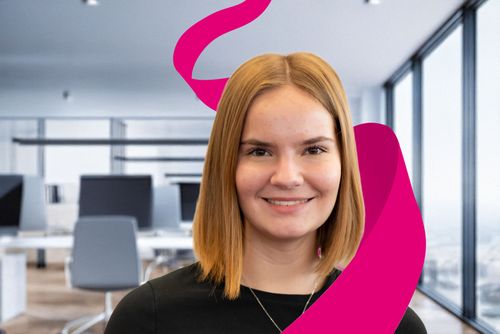 Smiling person in a modern office with a magenta ribbon design element in the foreground.