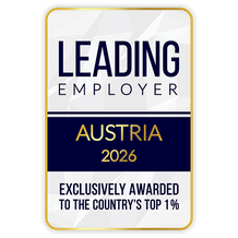Award badge reading "Leading Employer Austria 2026, Exclusively Awarded to the Country's Top 1%," in blue and gold text on a white background.